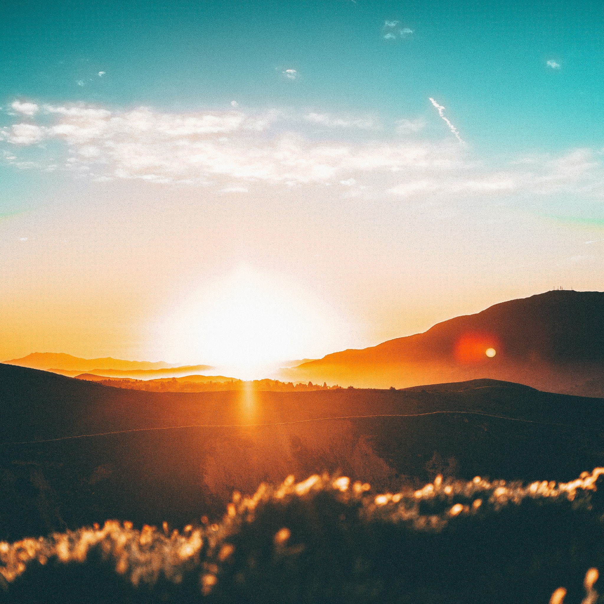 Golden sunset over rolling hills